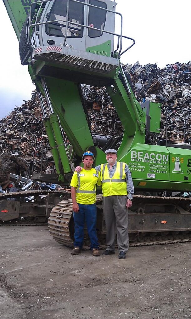 Representing the third generation for the family-owned Beacon Scrap Iron & Metal, Clyde Cameron III, left, is joined by his grandfather, William Smith Sr., the founder of the company.