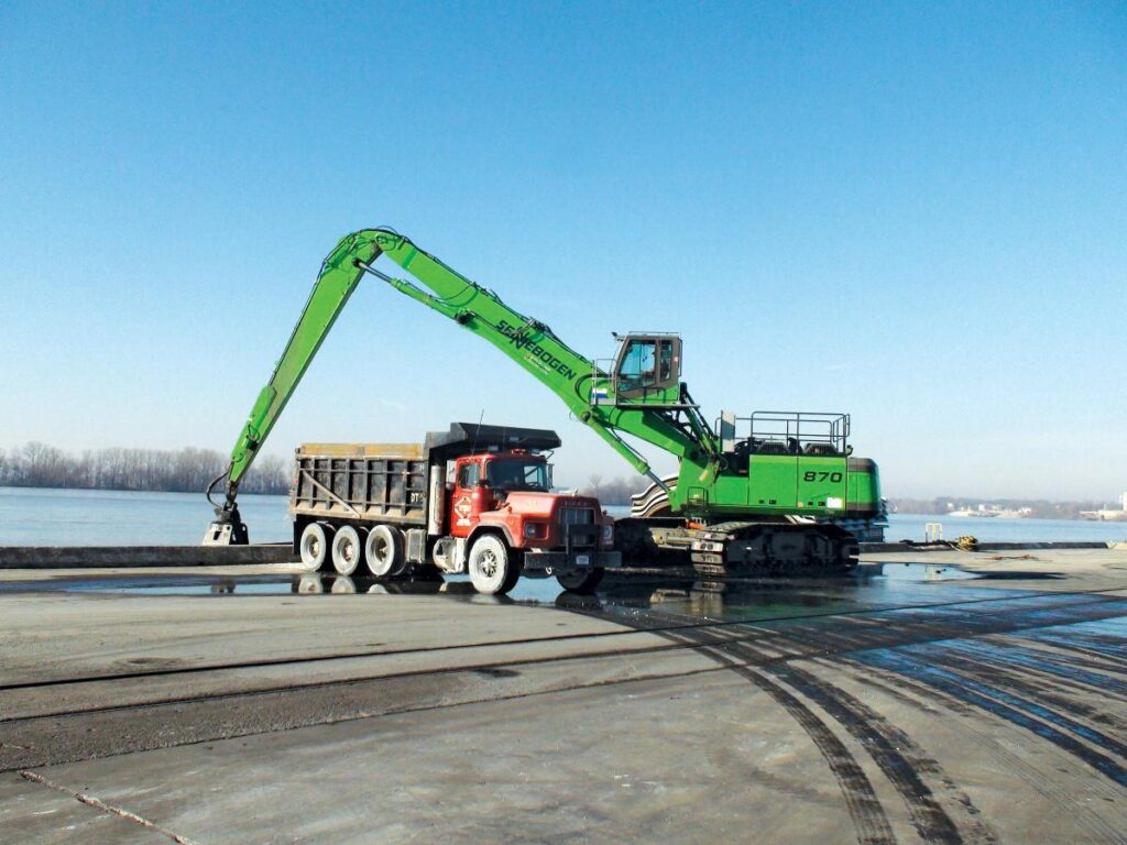 The Mt. Vernon Barge Service’s SENNEBOGEN 870 R-HD offloads talc along the Ohio River in southwestern Indiana.