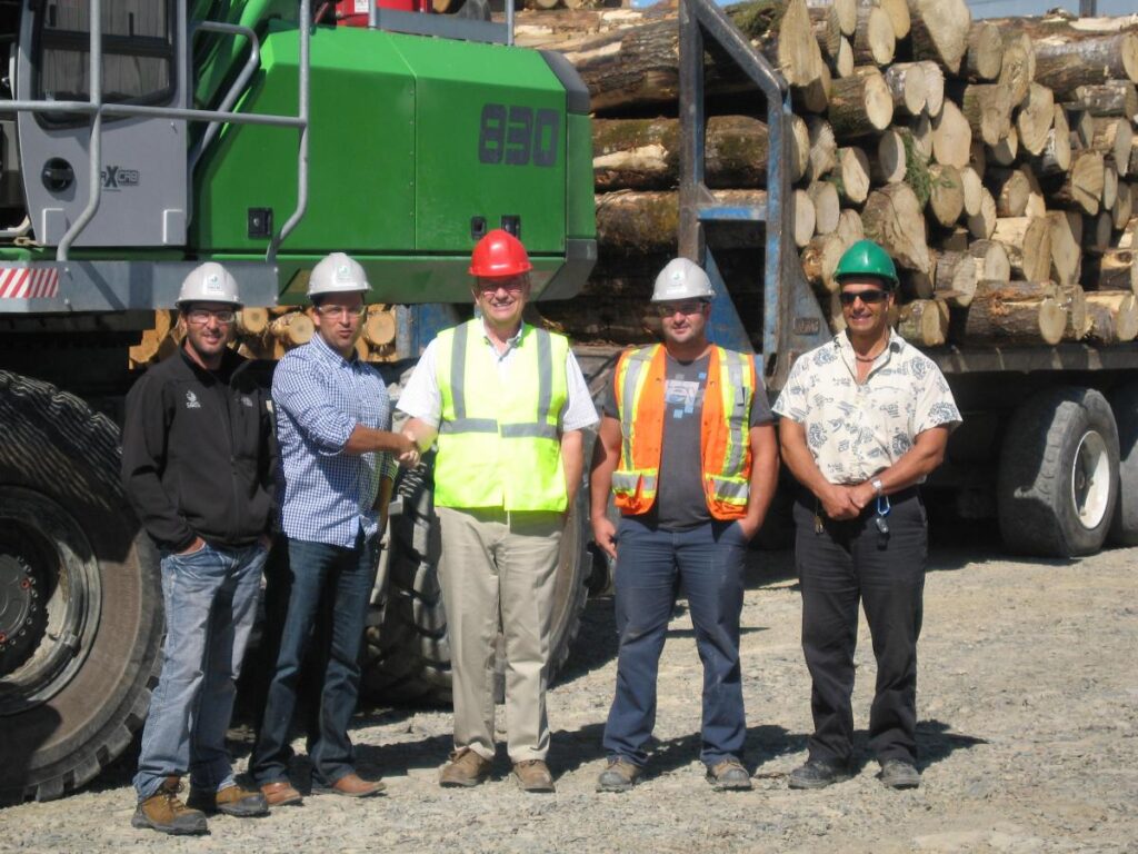 Strongco’s Territory Manager Allan Lindsay, centre,congratulates Vincent Caron on delivery of the SENNEBOGEN 830 M-T, joined by Caron’s Groupe Savoie team: Service Manager Tobby Leclair far left and, to the right, Yard Manager Tommy Lefebvre and Operator Mario Levesque.