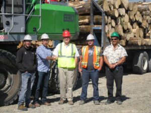  Strongco’s Territory Manager Allan Lindsay, centre, congratulates Vincent Caron on delivery of the SENNEBOGEN 830 M-T, joined by Caron’s Groupe Savoie team: Service Manager Tobby Leclair far left and, to the right, Yard Manager Tommy Lefebvre and Operator Mario Levesque.