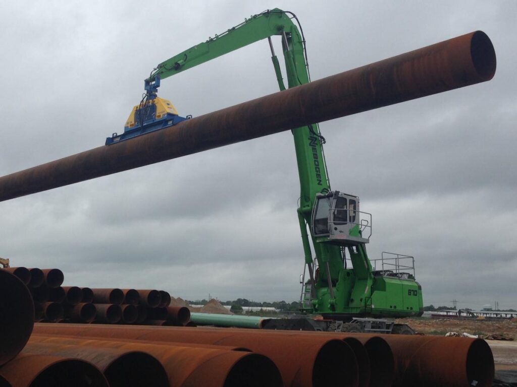 Berg Spiral Pipe selected the SENNEBOGEN 870 M for its combination of heavy lift capacity and long reach for stacking and loading steel pipe.