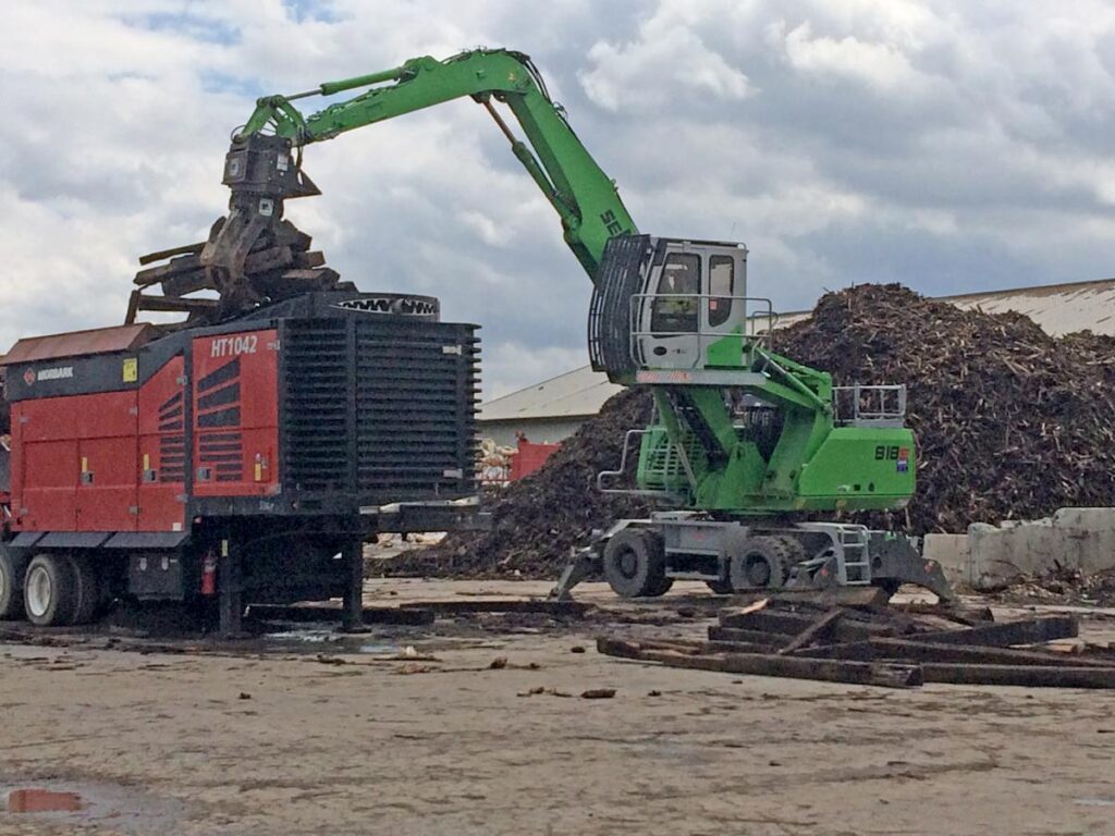 The purpose-built SENNEBOGEN 818 M loads a large slow-speed shredder as part of biomass production operations at Pennsylvania’s Zwicky Processing & Recycling, part of W.D. Zwicky & Son Inc.